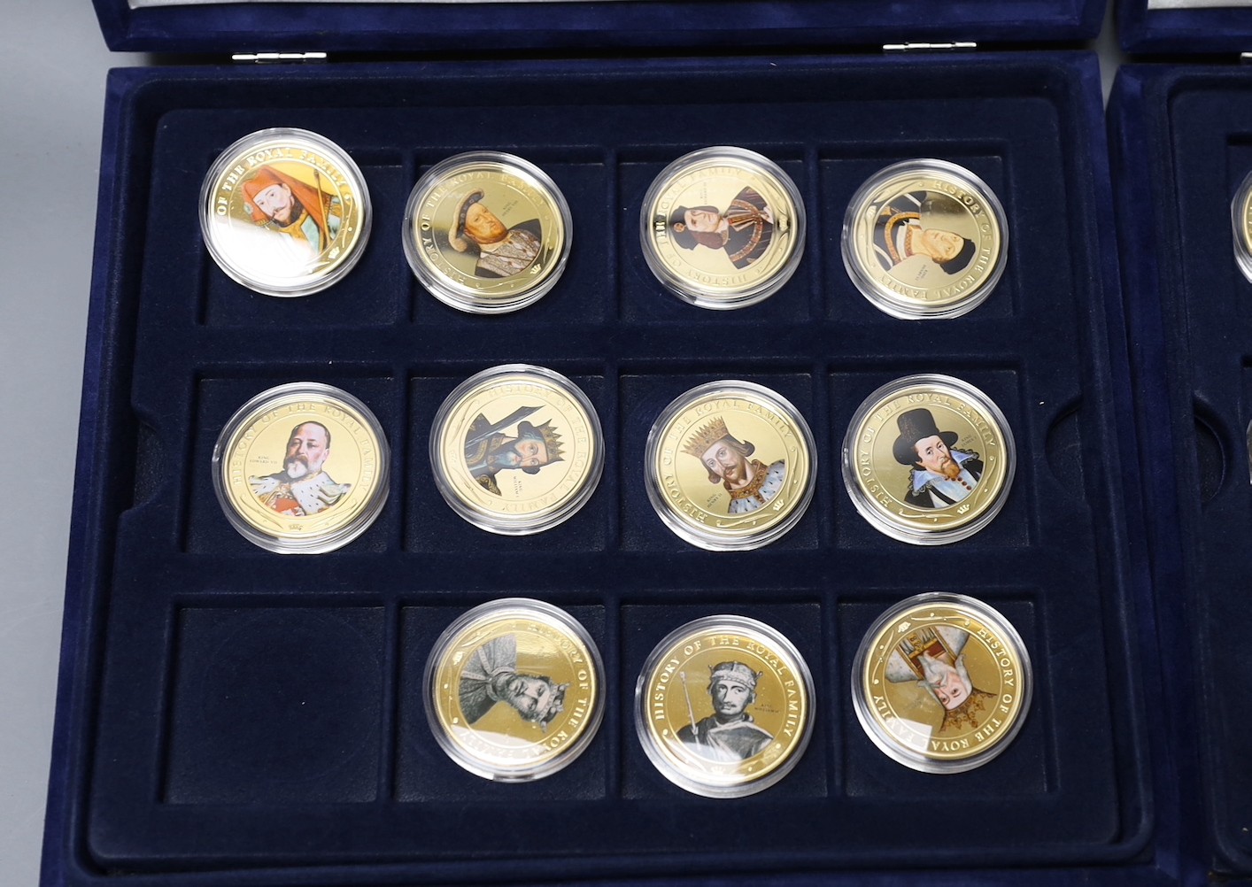 Two sets of Westminster coins in blue cases